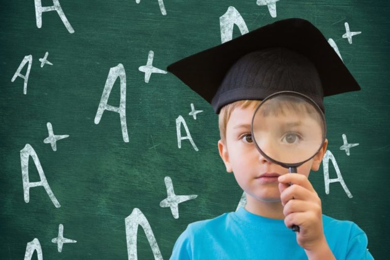 afterpay-share-price-forecast-apt-Boy in graduation cap holding magnifying glass against A positive sign in background
