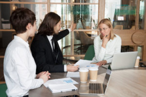 Rude businessman firing upset frustrated businesswoman telling to leave meeting