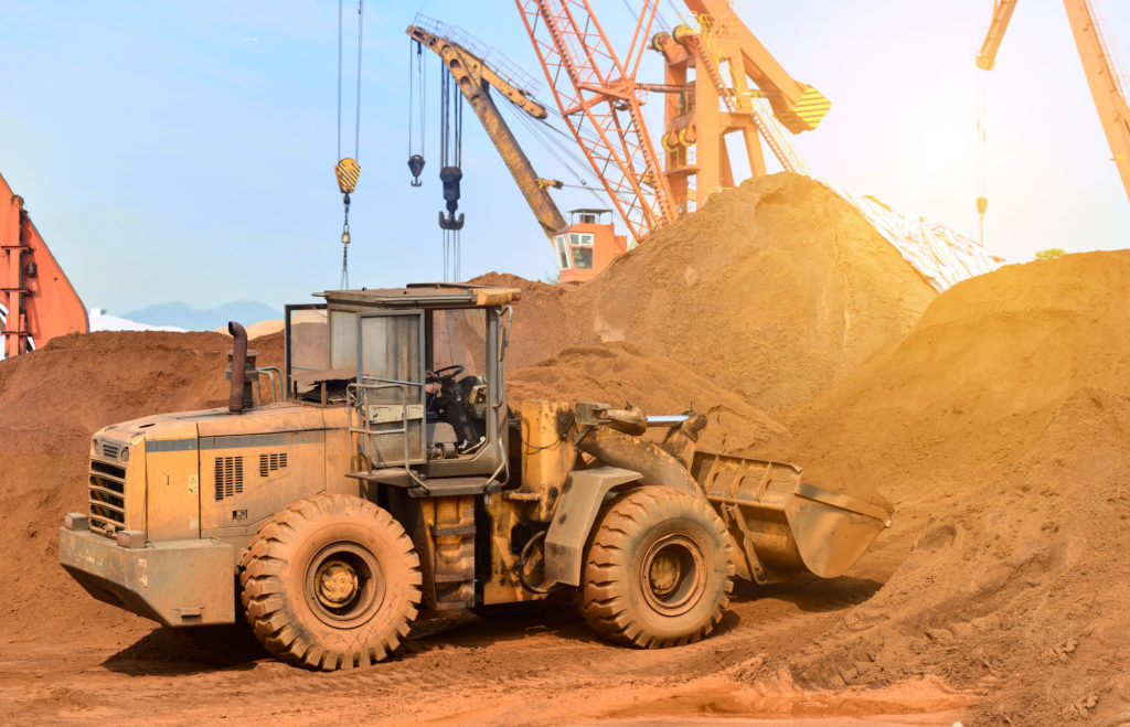 newcrest-mining-asx-ncm-ncm-share-price-Close-up of a construction site excavator