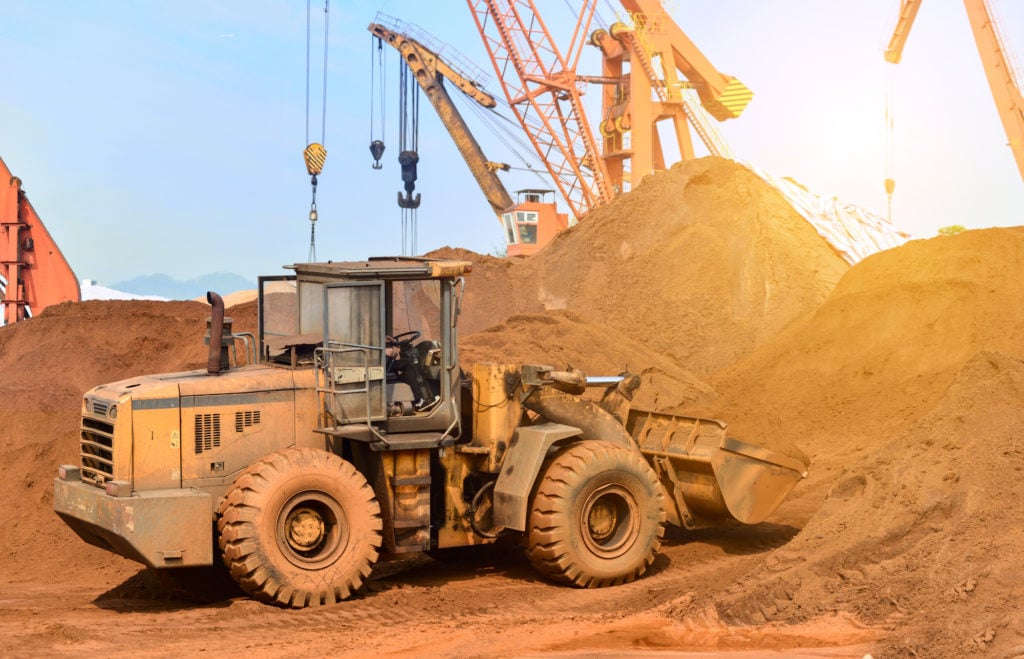 newcrest-mining-asx-ncm-ncm-share-price-Close-up of a construction site excavator