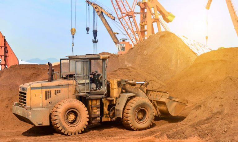 newcrest-mining-asx-ncm-ncm-share-price-Close-up of a construction site excavator