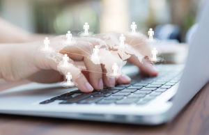 frontier markets like Africa shown on closeup of business woman hand typing on laptop keyboard