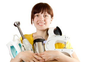 breville. image shows women holding multiple appliances like breville's.