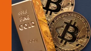Gold bar and physical coins with the symbol for Bitcoin
