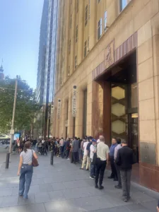 Lots of people standing in line outside a Gold exchange in Sydney