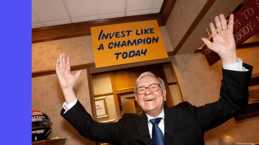 Warren Buffett stands and cheers infront of a sign saying "Invest like a champion today"