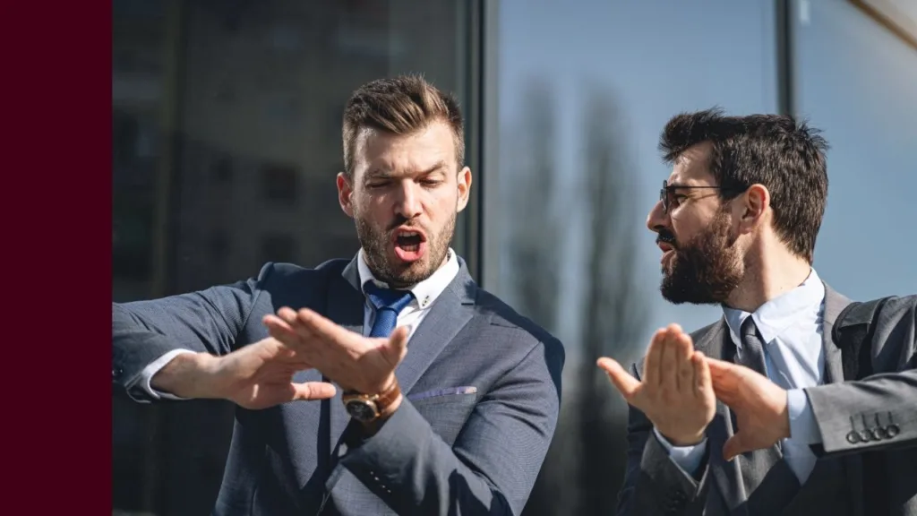 two professional males standing together gesturing with their hands to make it rain cash