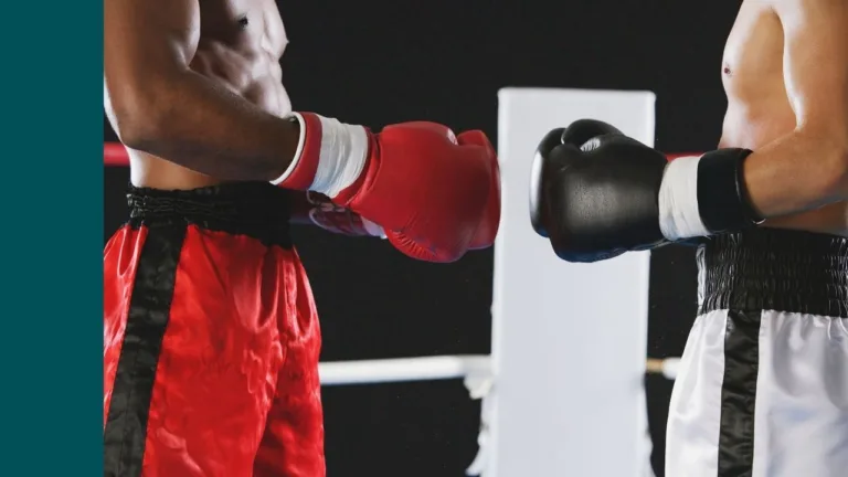 two boxers face off and touch gloves ready to fight