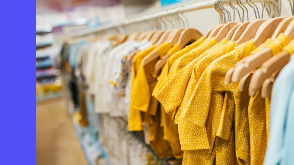 baby clothing hanging on rack in store
