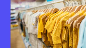 baby clothing hanging on rack in store