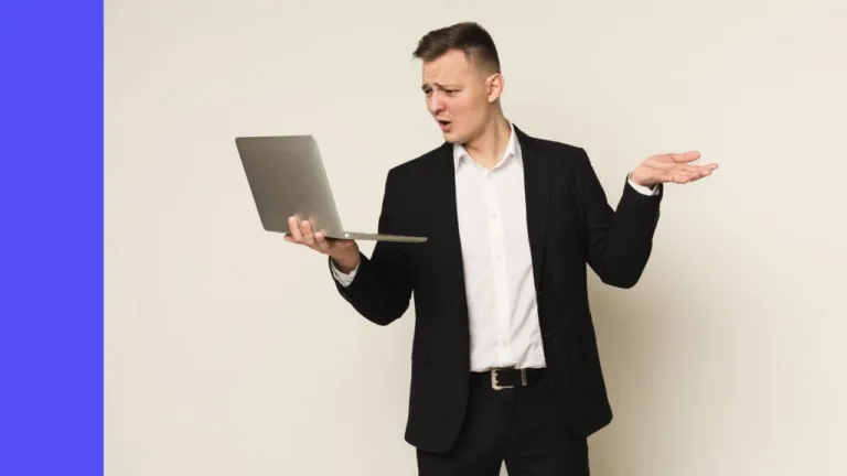 Man looks at laptop confused and questioning why