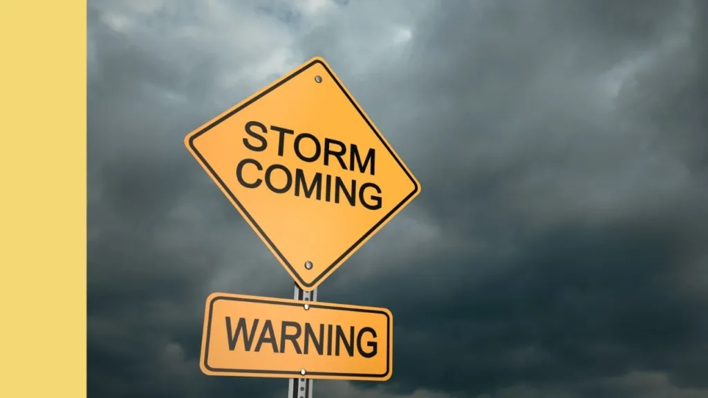 storm warning sign and dark clouds