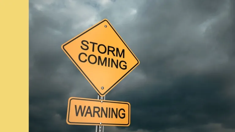 storm warning sign and dark clouds