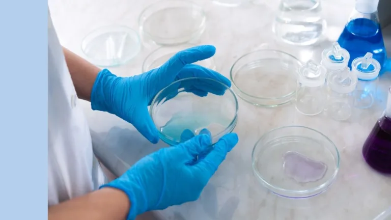 lab setting with a scientist looking at a petri dish