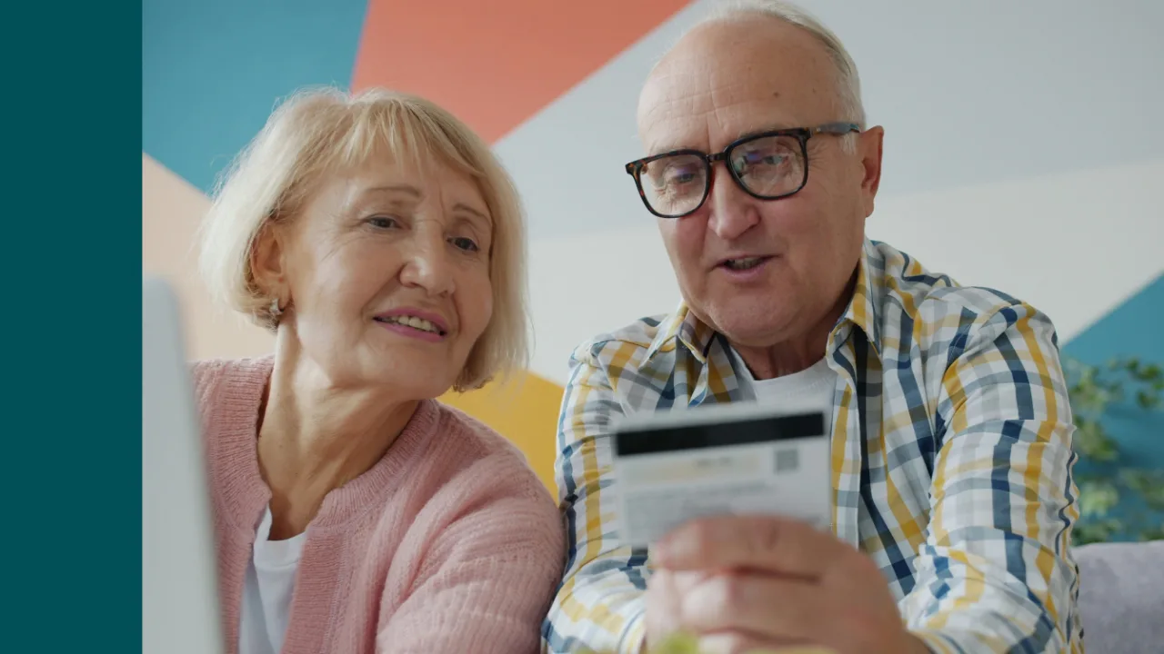 Older couple reviewing a paper document together